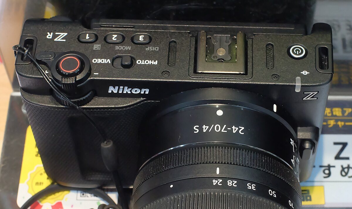 Nikon ZR rear display photographed in November 2025. The body is compact, but the control language is clearly aimed at video production.